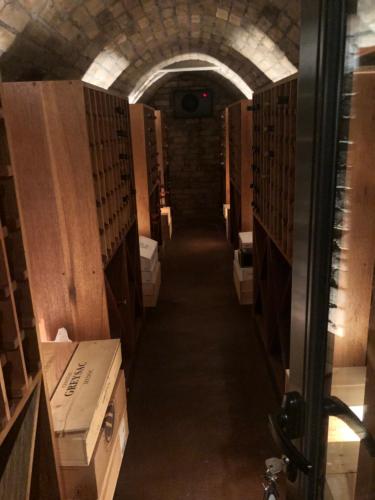 a long hallway of a bathroom with many toilets at Maison D’hôtes Coignet in Rose Hill