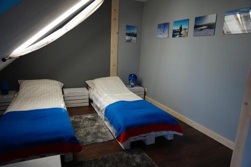 Llit o llits en una habitació de Świetnokrzyska Chata