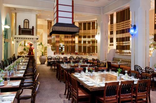a dining room with long tables and chairs at Herods Palace Hotels & Spa Eilat a Premium collection by Fattal Hotels in Eilat