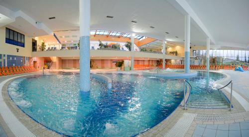 a large indoor swimming pool in a building at HOTEL Bioterme Mala Nedelja in Ljutomer