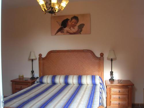 A bed or beds in a room at VTV Amores Residencial2000