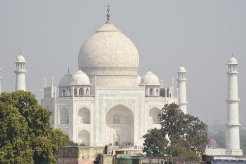 a large white building with two domes at Lucky Restaurant & Guest House in Agra