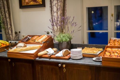 a buffet with different types of bread and pastries at Vihula Manor Country Club & Spa in Vihula