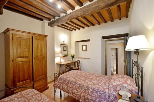 Ένα ή περισσότερα κρεβάτια σε δωμάτιο στο Pinturicchio