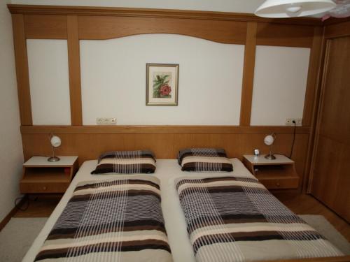 Кровать или кровати в номере Sonnenpark, Ihr Bett im Allgäu