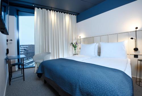 Säng eller sängar i ett rum på Best Western Plus Grow Hotel