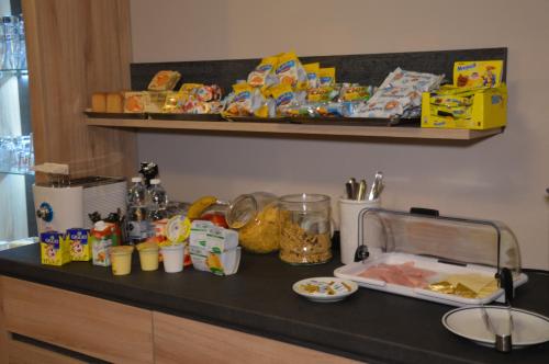 a counter top with food and snacks on it at Casa Citella in Bussolengo