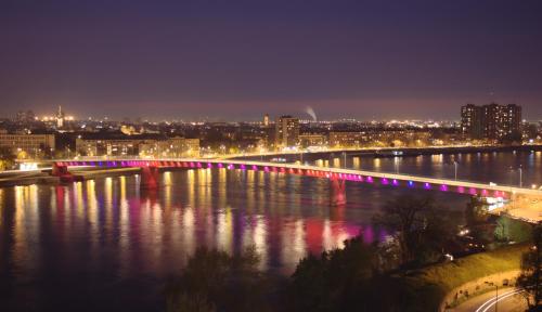 a bridge over a river with a city at night at ! PROMO! Central Evergreen Studio - Free Public Parking-Fast WI-FI in Novi Sad