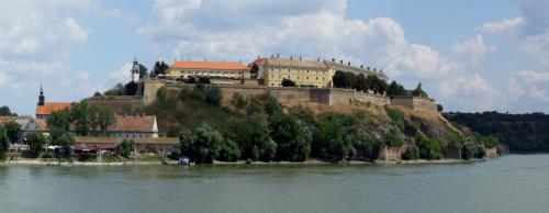 a building on top of an island in the water at ! PROMO! Central Evergreen Studio - Free Public Parking-Fast WI-FI in Novi Sad