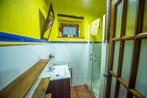 a bathroom with a sink and a shower at Las Huertas in Monachil