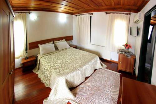 a bedroom with a large bed in a room at Akay Hotel in Selcuk