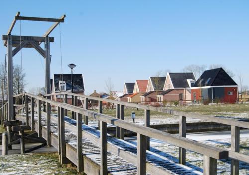 a train track with houses in the background at Waterdorp Burdaard in Burdaard