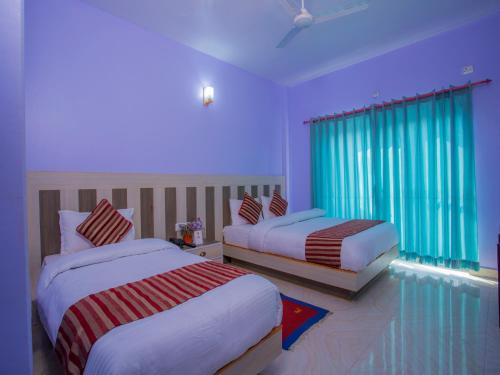 Un pat sau paturi într-o cameră la Hotel City Palace