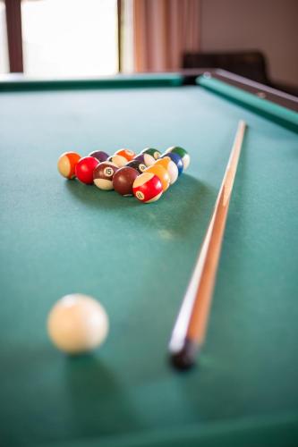 a cue ball on top of a pool table at gut-Hotel Tannenhof in Haiger