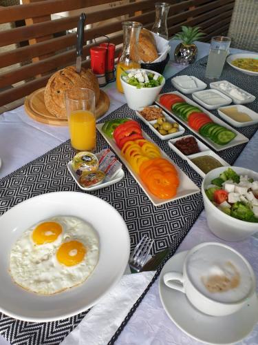 a table with eggs and vegetables and other food at Spat Beach in Bat Yam