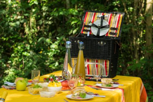 a table with food and a basket on top of it at The Royal Senchi Hotel and Resort in Oko Sombo