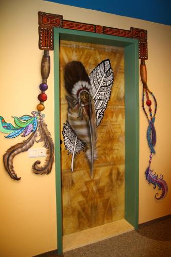 a glass door with a painting of a butterfly at Kunsthof Eibenstock in Eibenstock