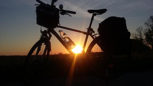 a bike parked in front of the sunset at Agroturystyka na Słonecznej Orawie u Dzikich in Jabłonka