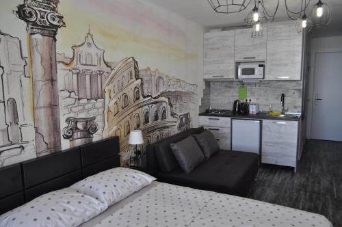 a room with a bed and a kitchen at Frozen View New Gudauri in Gudauri