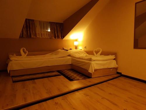 Ένα ή περισσότερα κρεβάτια σε δωμάτιο στο ВАЛЕНТИНО
