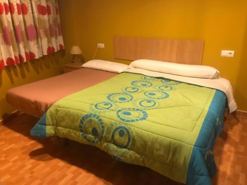 Łóżko lub łóżka w pokoju w obiekcie Apartamentos Duquesa Sierra Nevada