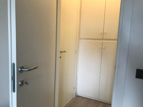 an empty room with a door and a closet at LA CONCHIGLIA A MARINA in Marina di Carrara