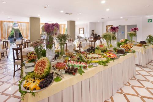 a buffet line with many different types of fruits and vegetables at Hotel Alpha in Sant'Agnello
