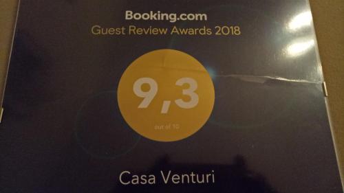 a sign that says guest review awards at Casa Venturi in Gubbio