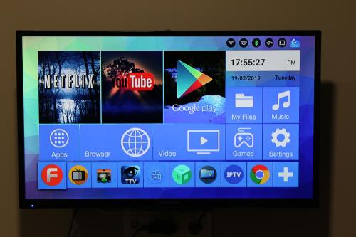 a television screen with many different apps on it at Old Slabada Apartments in Kaunas