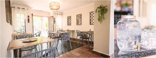 a room with a table and a vase on a counter at LilyRose Bed & Breakfast in Pretoria