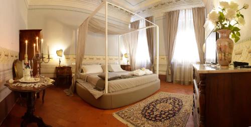 Cama o camas de una habitación en Residenza D'Epoca -Santa Caterina