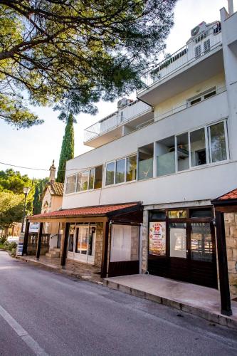 a building on the side of a street at Apartment Boras Lux in Cavtat