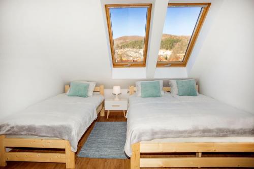Posteľ alebo postele v izbe v ubytovaní Apartament w Rynku