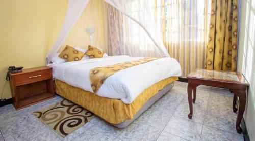 Cama o camas de una habitación en Hotel Embassy