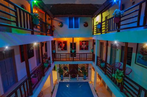 an overhead view of a building with a swimming pool at Mestizo Gallery in Tulum