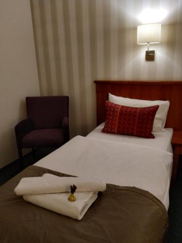 Кровать или кровати в номере Hotel Stare Miasto Old Town