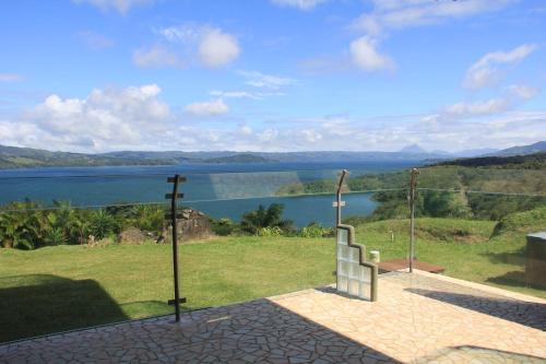 a view of a body of water with a cross at Lake Arenal Condos in Naranjos Agrios