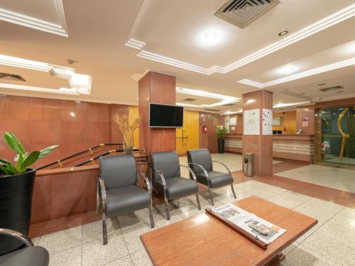 Una televisión o centro de entretenimiento en Real Castilha Hotel