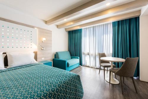 Una cama o camas en una habitación de Hotel Casa Blanca
