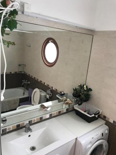 a bathroom with a sink and a mirror at Room Complex Bungamar in Playa de las Americas