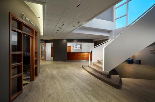 a hallway of an office building with a staircase at Hotel Klaustur in Kirkjubæjarklaustur