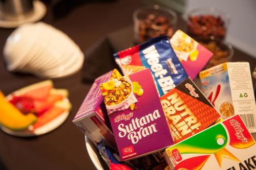 a pile of snacks on top of a table at Wine Country Motor Inn in Cessnock