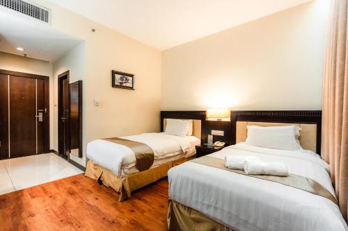 Postel nebo postele na pokoji v ubytování Hotel S Damansara