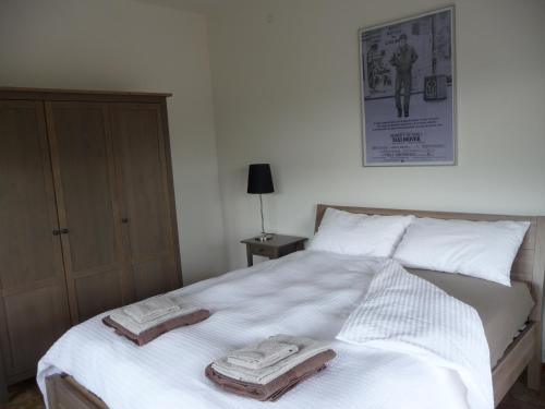 a bedroom with a bed with towels on it at Casa Balducci Bed&Breakfast in Mercatello sul Metauro