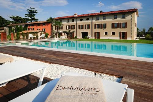 a view of the pool from the balcony of a hotel at Belvivere Suites in Sona