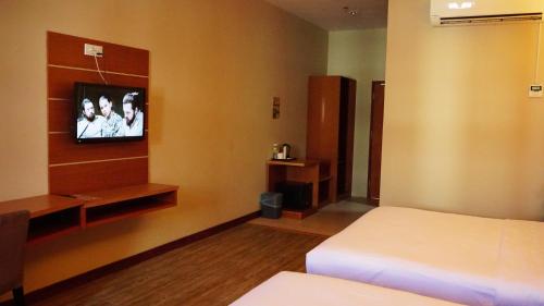 Tempat tidur dalam kamar di Best Star Resort