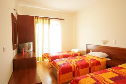 Postel nebo postele na pokoji v ubytování Hotel Metropole