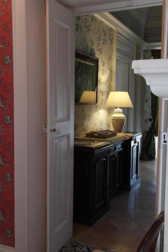 a room with a desk with a lamp on it at Villa in Gargano - VILLA BASSO in Monte SantʼAngelo