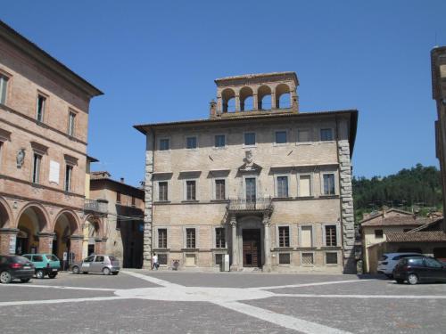 an old building with a tower on top of it at Casa Balducci Bed&Breakfast in Mercatello sul Metauro
