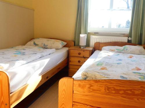 Voodi või voodid majutusasutuse Ostsee-Ferienoase-3-Raum-App-Typ-1 toas